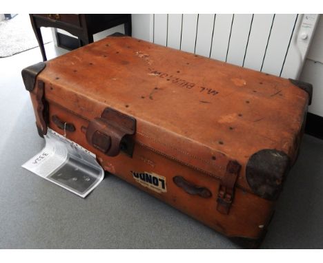A large leather bound trunk, a smaller leather suitcase, both bearing 'Cunard Whitestar Line' luggage stickers, amongst other