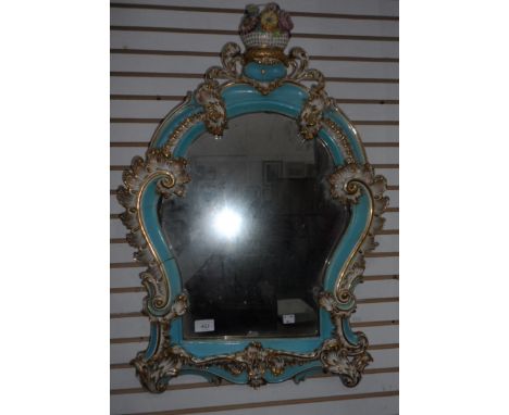 Blue and white ceramic mirror with basket of flowers 