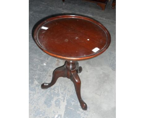 Circular topped occasional table on tripod feet