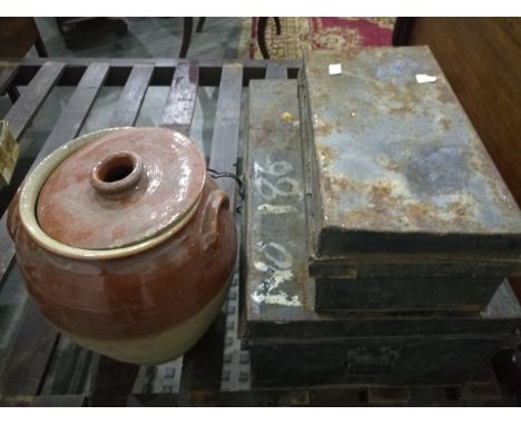 A large black metal trunk and a smaller black trunk (2) 