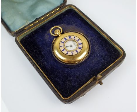 A lady's 18ct gold half hunter fob watch, circa 1890, swiss made, the white enamel dial with black Roman numerals and subsidi