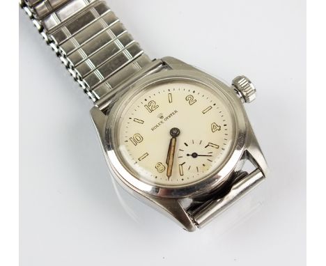 A Rolex stainless steel oyster wristwatch, the circular white dial with luminous hands, arabic numerals and subsidiary second