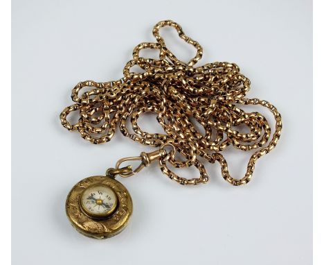 A yellow metal guard chain, the swivel stamped '9c', suspending yellow metal compass fob, length of chain 140cm, total weight