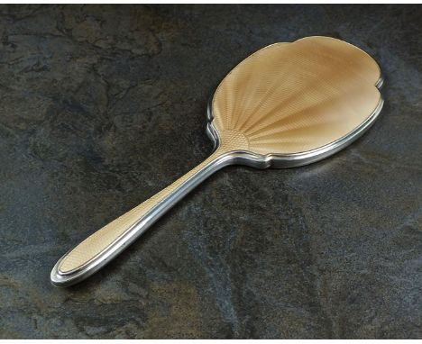 A silver and guilloche enamel mounted hand mirror, Albert Carter, Birmingham 1933, 27cm long