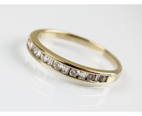 A diamond set half hoop eternity ring, designed as seven brilliant cut diamonds each interpersed with six baguette cut diamon