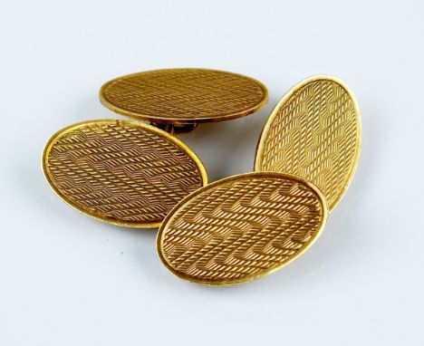 A pair of 18ct gold cufflinks, the oval plaques with engine turned decoration, hallmarked Deakin & Francis, Birmingham 1929, 