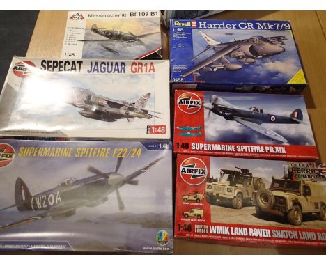 Six 1/48 scale kits including Jaguar, two Spitfires, Harrier, BF109 and Land Rover, appear complete/unchecked, boxes have wea