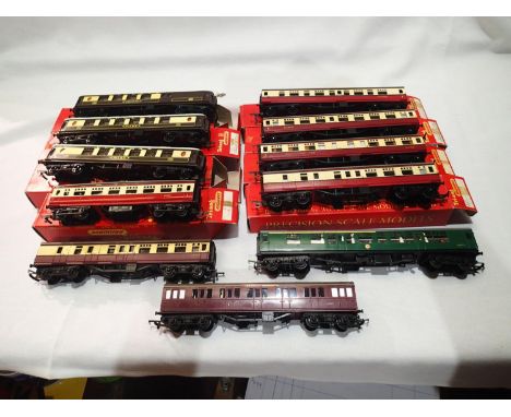 Eleven OO scale assorted Triang coaches, including three Pullmans, Blood/Custard, Green etc, mostly in good condition. UK P&a