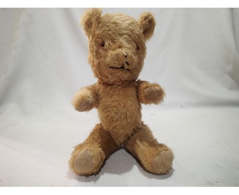 Vintage straw filled teddy bear, jointed arms and legs, H: 30 cm. UK P&amp;P Group 1 (£16+VAT for the first lot and £2+VAT fo