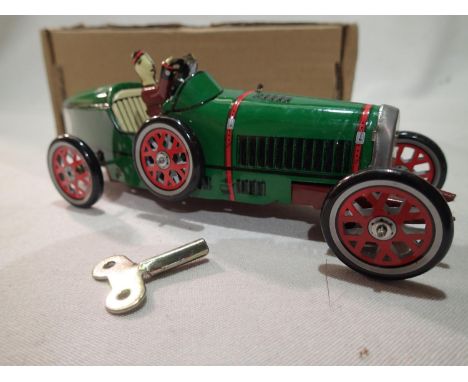 Tinplate clockwork vintage racing car, H: 18 cm, with key, working at lotting. UK P&amp;P Group 1 (£16+VAT for the first lot 