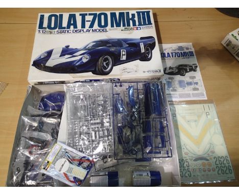 Tamiya 1/12 scale Lola T-70 MK111, appears complete/unstarted, unchecked, box with storage wear. UK P&amp;P Group 2 (£20+VAT 