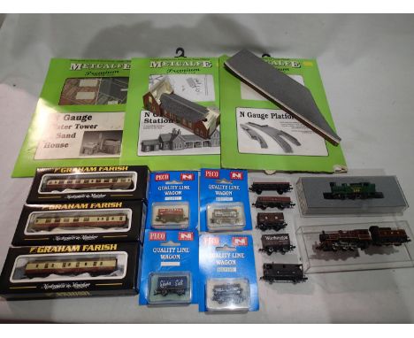 Two N gauge locomotives, three coaches and nine wagons, mostly in very good to excellent condition, plus three part built car