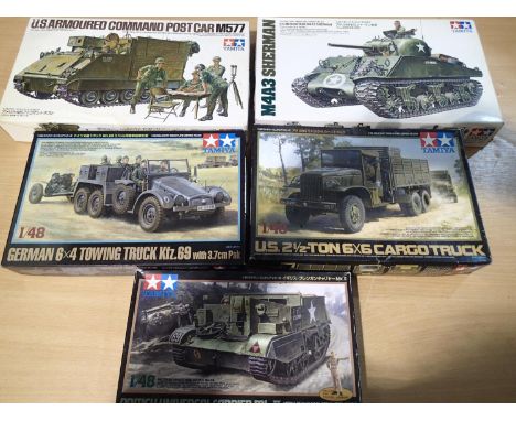 Five Tamiya 1/35 and 1/48 scale military related kits, appear complete/unchecked, boxes with wear. UK P&amp;P Group 1 (£16+VA