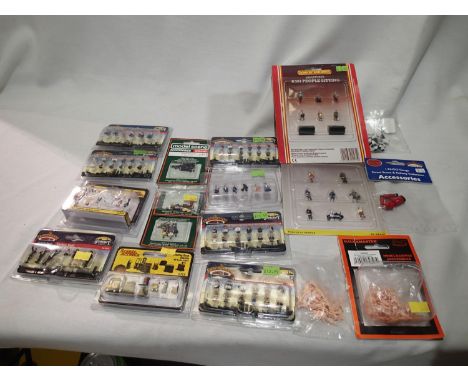 OO scale figures and animals, including two Hornby, seven Bachmann, three Merit, two Woodland Scenics, all in sealed packs. U