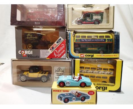 Seven boxed Diecast vehicles, Corgi buses, vintage cars, fire engine, Dinky Atlas Triumph, mostly in excellent condition, wea