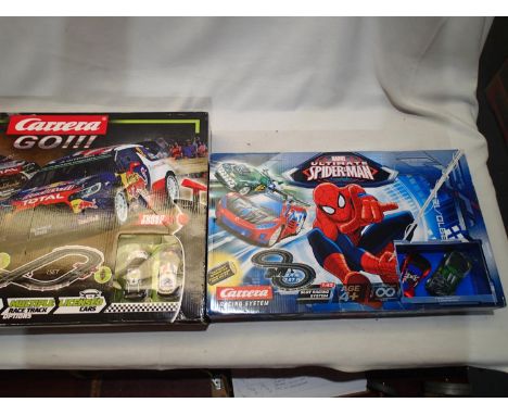 Two Carrera 1/43 scale slot car sets, Marvel Ultimate Spiderman and Rally Up, both appear complete in excellent condition, we