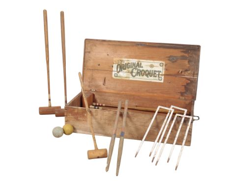 A VICTORIAN CROQUET SET by Original Croquet, London, retailed by F. H. Ayrs, including mallets, hoops and balls, in the origi