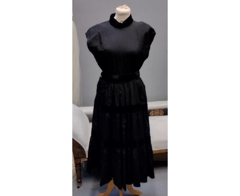 Two 1950's/60's vintage black party dresses; one has pleated detail and the other has velvet stripes and a velvet collar with