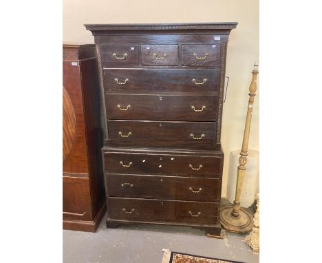 Early 19th century oak chest on chest, the moulded dental cornice above an arrangement of three short and three long drawers,