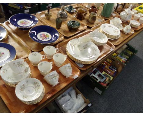 Four trays of Royal Albert fine bone china 'Haworth' tea and dinnerware, wild rose pattern on a white ground with gilt edging