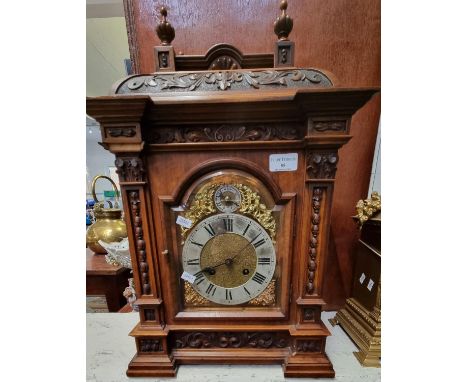 Early 20th century German walnut cased two train bracket clock with brass dial having silvered Roman chapter ring, foliate ca