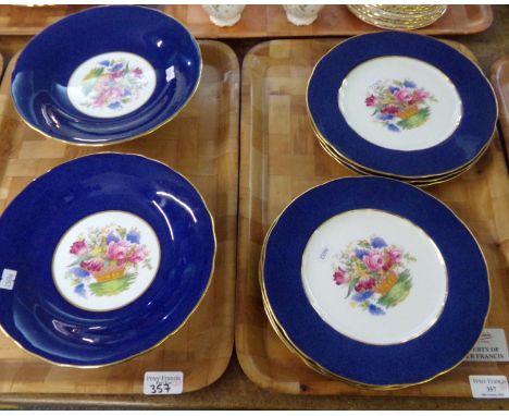 Six Copeland Spode dinner plates with blue and gilt rims and central rose, lilac and tulip floral basket decoration and two m