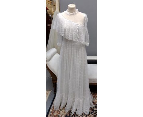 Vintage 1970's lace wedding dress with tiered skirt, sheer sleeves and one shoulder ruffle. (B.P. 21% + VAT) 