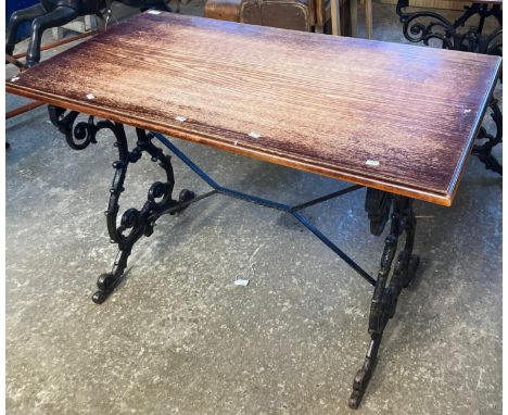 Vintage oak top pub table with ornately scroll decorated cast iron base.   (B.P. 21% + VAT) 