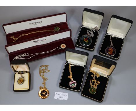 A collection of enamel coins, one on 9ct gold chain.(B.P. 21% + VAT) 