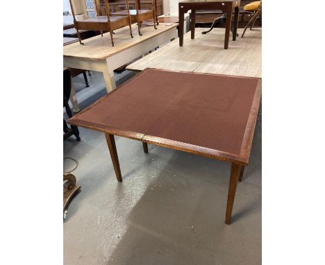 19th century mahogany fold over card table of plain form on square tapering legs.  (B.P. 21% + VAT) 