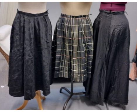 Three vintage 40's-60's skirts; one black damask with bow pattern, one black ground plaid and a long black skirt. (3)(B.P. 21