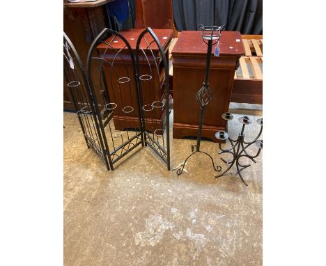 Three metal furnishing items, to include: pierced three section screen, table candelabra and another table candlestick holder