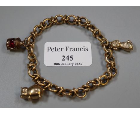 Unmarked yellow metal charm bracelet with three 9ct gold animal and lantern charms. 13.5g approx. (B.P. 21% + VAT) 