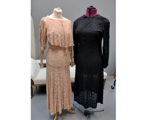 Two vintage 1930's lace dresses; one in pale pink floral pattern lace with a cowl neck, long sleeves and belt and the other b