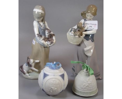 Two Spanish Lladro porcelain figurines of young girls with puppies and kittens, together with a Lladro porcelain Christmas ba