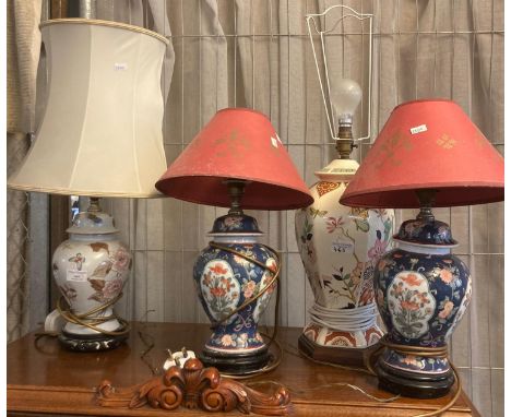 Pair of Oriental design porcelain floral baluster table lamps together with two other Oriental taste ceramic table lamps, thr