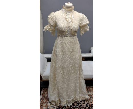 Vintage designer florally embroidered wedding dress (probably 1970's), with cap sleeves, high neck and train. Has a label 'Al