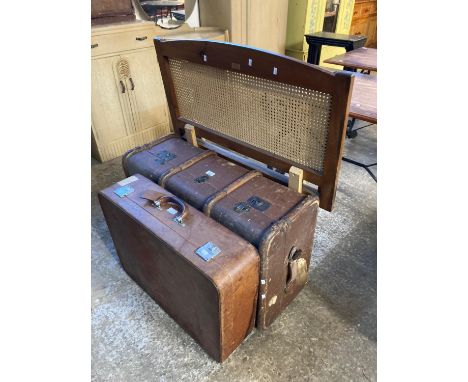 Two vintage suitcases together with a pair of modern cane back single bed ends.  (4)  (B.P. 21% + VAT) 