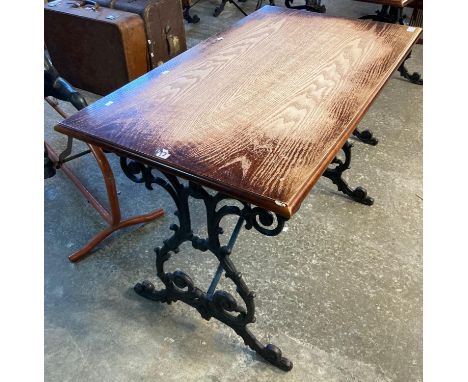 Vintage oak top pub table with ornately scroll decorated cast iron base.   (B.P. 21% + VAT) 