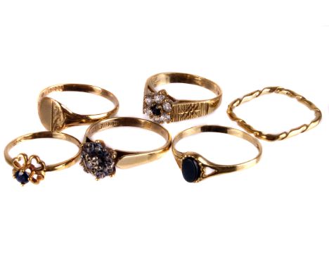 Six 9ct gold gem set rings,  including a sapphire and diamond flower cluster with ring, an illusion set diamond cluster ring,