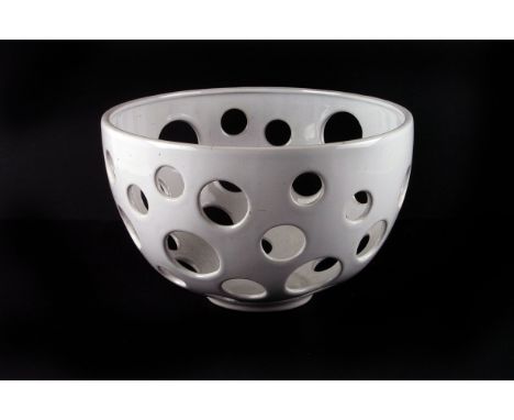 A pair of white glazed ceramic bowls,  pierced with variably sized holes, 25cm diameter