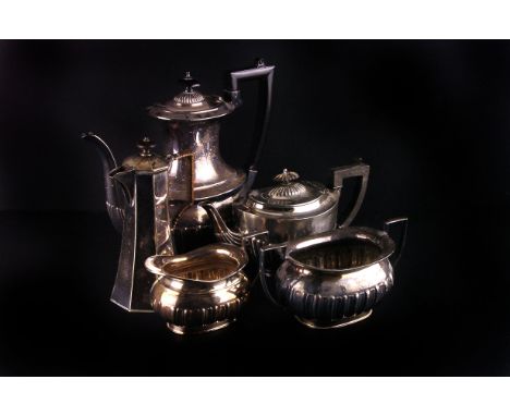 An Edwardian four piece tea and coffee service,  of baluster form with semi gadrooned body, together with other items of elec