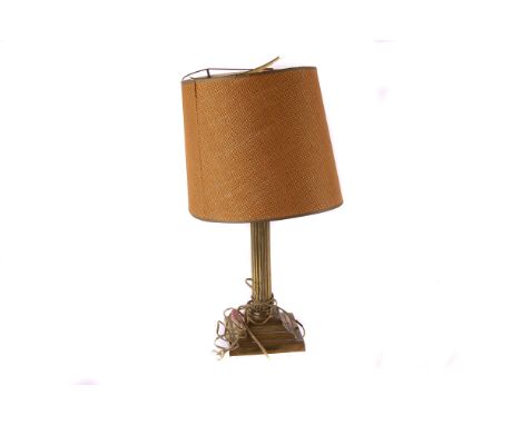 A brass Corinthian Column lamp base,  with fittings, 29cm high, together with a circular wall mirror and a framed print of a 