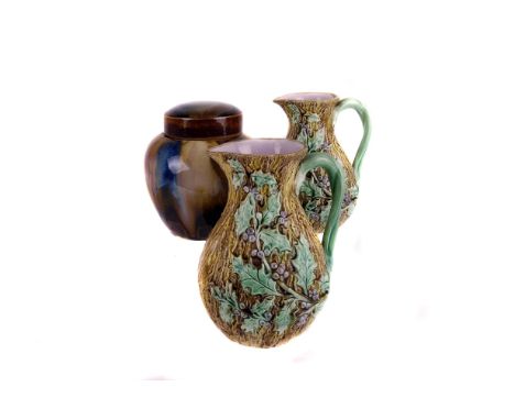 A group of Victorian majolica,  including three plates, a nice pair of jugs, and a covered jar 