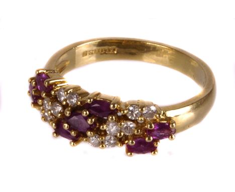 A ruby and diamond half hoop ring,  the three rows alternately set with a oval cut ruby and a pair of brilliants, mounted in 