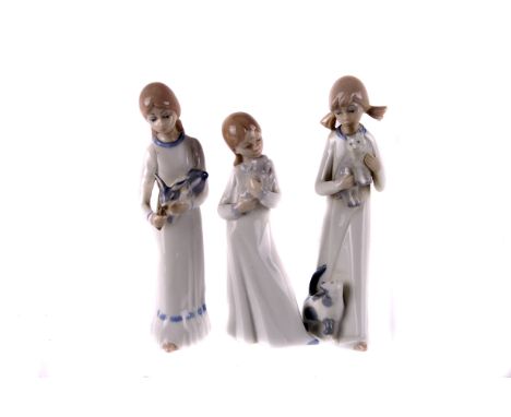 A Nao figure of a girl with pup,  together with two Casades examples (3)