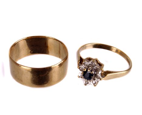 An 9ct gold wedding band,  finger size approx. K/L, together with a sapphire and diamond cluster ring, mounted in yellow gold