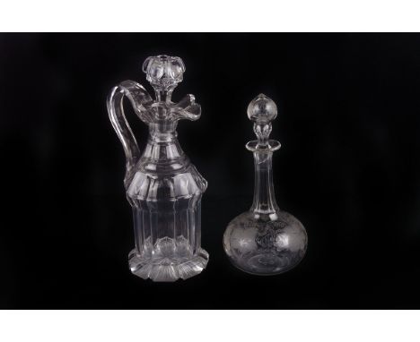 Lead Crystal Claret Jug,  together with two decanters and an etched glass decanter with grape vine design.AF  