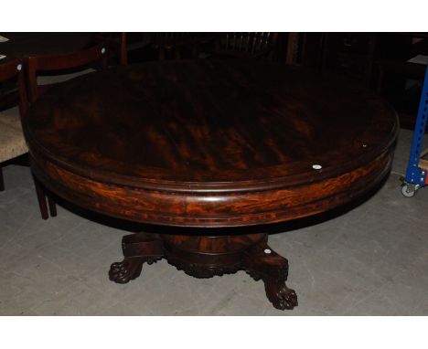 A William IV mahogany breakfast table, circular top with four shaped drawers to frieze, supported on a pedestal tripod base w