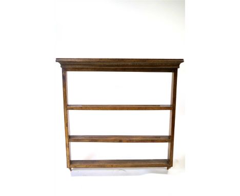A 19th century country oak three-tier wall-hanging dresser / plate rack, above a bracket cornice, 106 cm high, 102 cm wide, 1